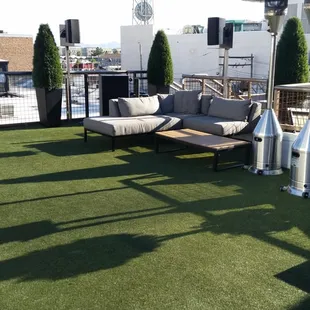 a patio with a couch and a table