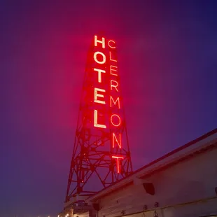 the neon sign for the hotel