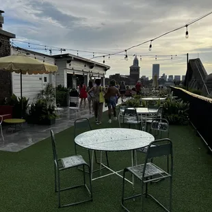 a patio with tables and chairs