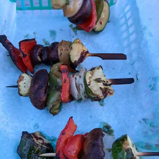 skewered vegetables on skewers in a basket