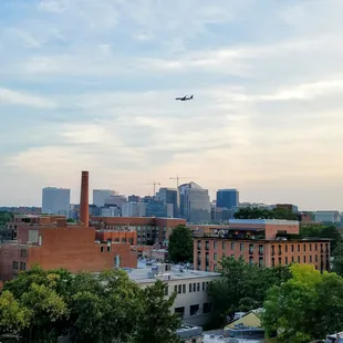 a plane flying over a city