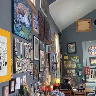 Interior, middle, larger tables and art