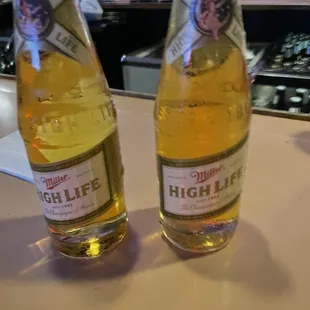two bottles of high life beer