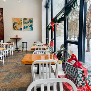 tables and chairs with presents on them