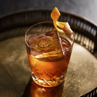 THE ROOSEVELT ROOM OLD FASHIONED rr buffalo trace single barrel bourbon, demerara syrup, angostura bitters, wormwood bitters, orange peel