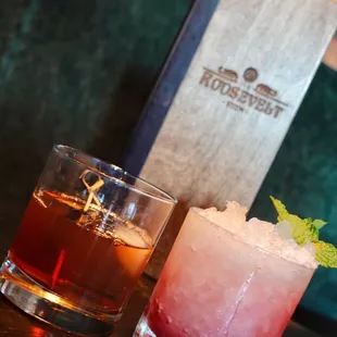 two cocktails on a table