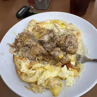 The Bulldog 2 eggs over easy chicken fried steak and bacon hash browns and 2 biscuits with gravy.