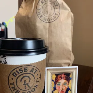 a coffee cup and a picture of a woman