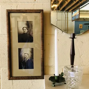 a portrait of a man and a candle