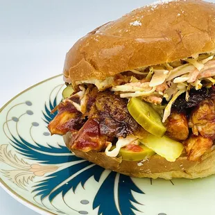 NEW! BBQ Chicken Sammie. Pulled chicken, house BBQ, Sonoma Brinery pickles on a brioche bun, served with sweet potato croquettes.