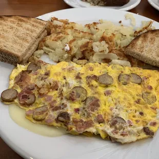 Meat lovers omelette with provolone cheese, rye toast