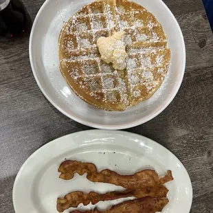 Waffle with infused strawberry butter, side of crispy bacon.