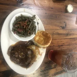 Salisbury steak, garlic mashed potatoes, green beans band their delicious biscuits