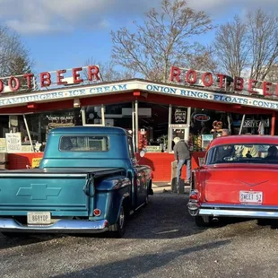 old cars parked in front of it
