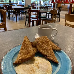 Two eggs over medium with wheat toast. Perfectly cooked and sooo delicious.