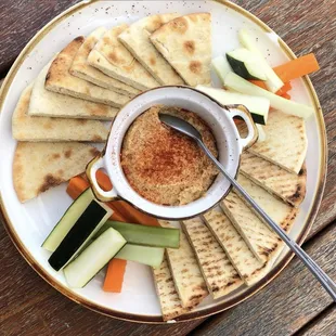 Hummus is back! Come get it with pita bread and veggies!