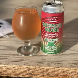 a can and a glass of beer