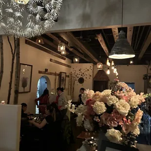 a vase of flowers in a restaurant