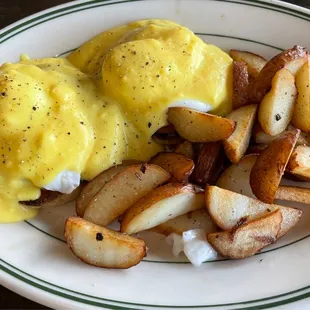 a plate of eggs and potatoes