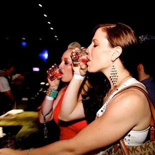 two women drinking wine
