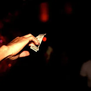 a hand holding money