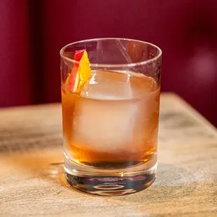 a drink in a glass on a table