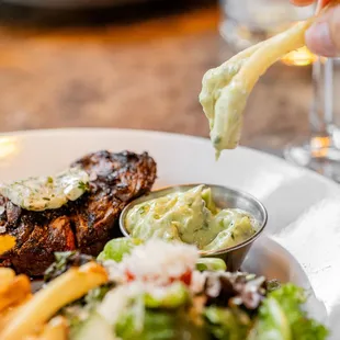 a plate of food and a glass of wine