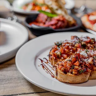 a plate of pizza and a plate of bread
