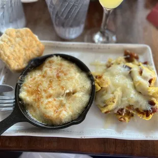 Cheese grits with chef&apos;s scramble.