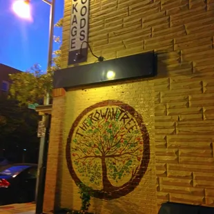 a tree on the side of a building