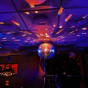 a disco ball suspended from the ceiling
