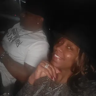 a woman in a black hat and a man in a white shirt