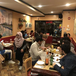 a group of people sitting at a table