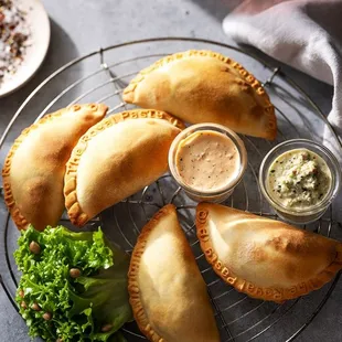 four pasties on a wire rack