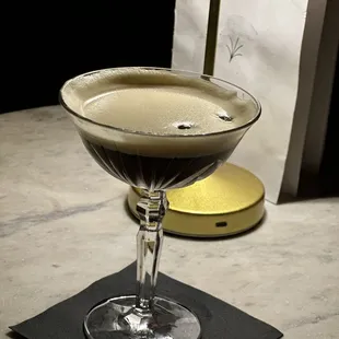 a cocktail in a coupe glass