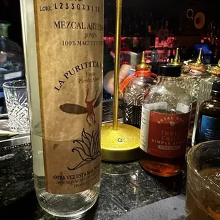 a bottle of liquor on a bar counter