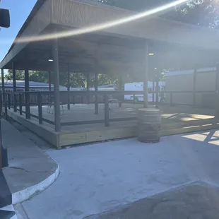 There's a patio area outside as well that's covered with a few tables/chairs