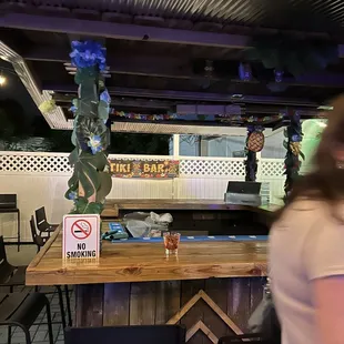 a woman sitting at a bar