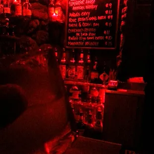 All red lighting and they serve absinthe with some unique tunes