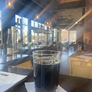 a glass of beer on a table