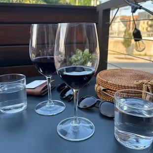 three glasses of wine on a table