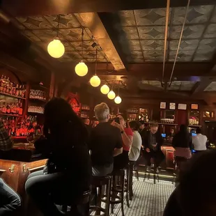 people sitting at the bar