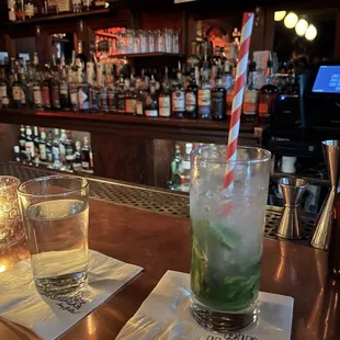 a glass of water and a drink