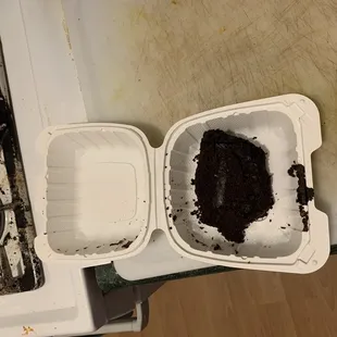 two containers of food left on the stove