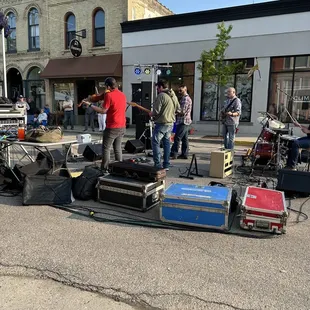a group of people playing music on the street