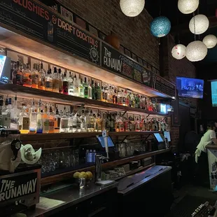 a bar filled with bottles of alcohol