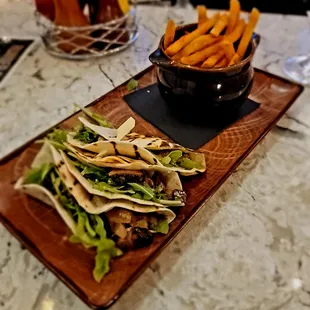 Short rib tacos with a side of fries