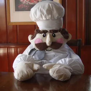 a teddy bear dressed as a chef