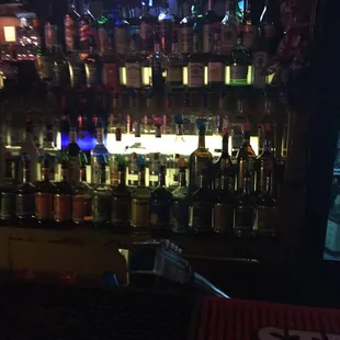 a bar filled with bottles of alcohol