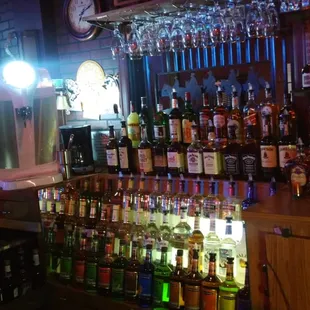 a bar full of alcohol bottles